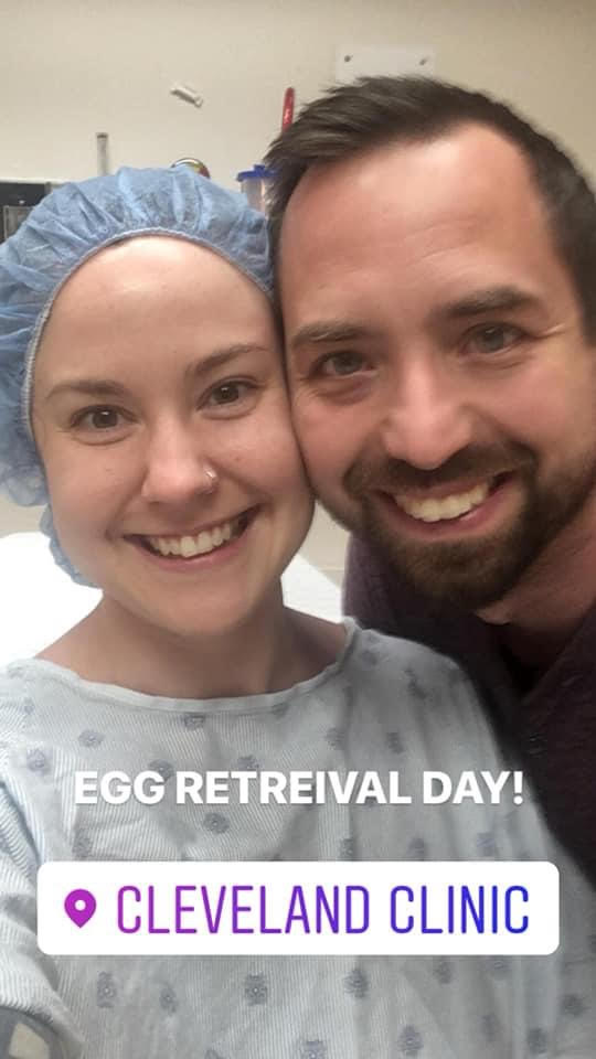 Smiling couple before their egg retrieval for IVF