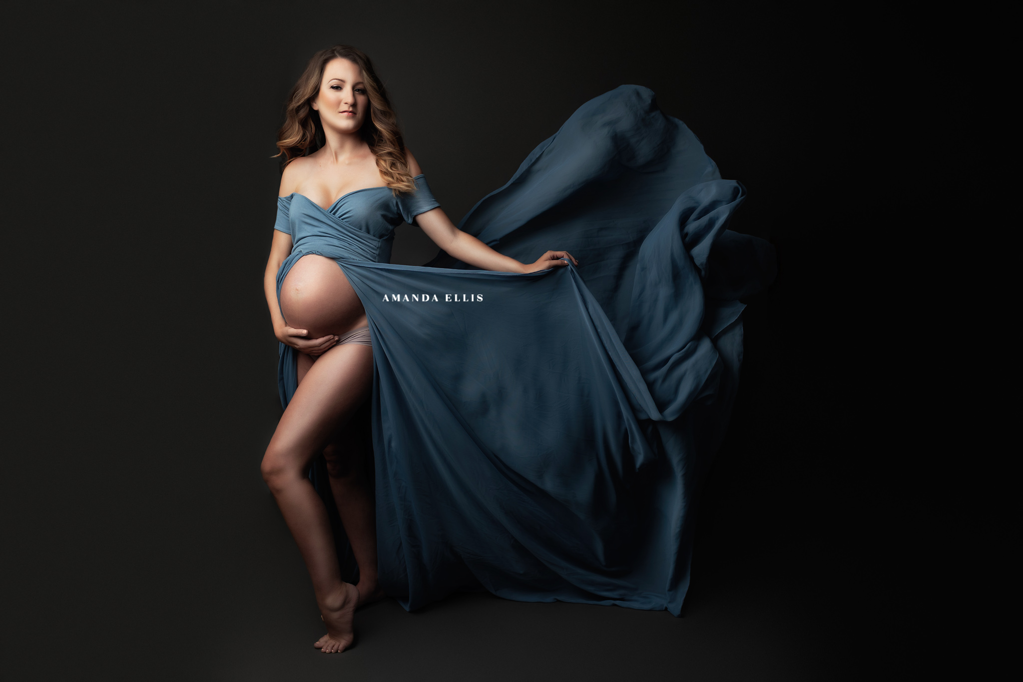 pregnant mother in blue maternity dress