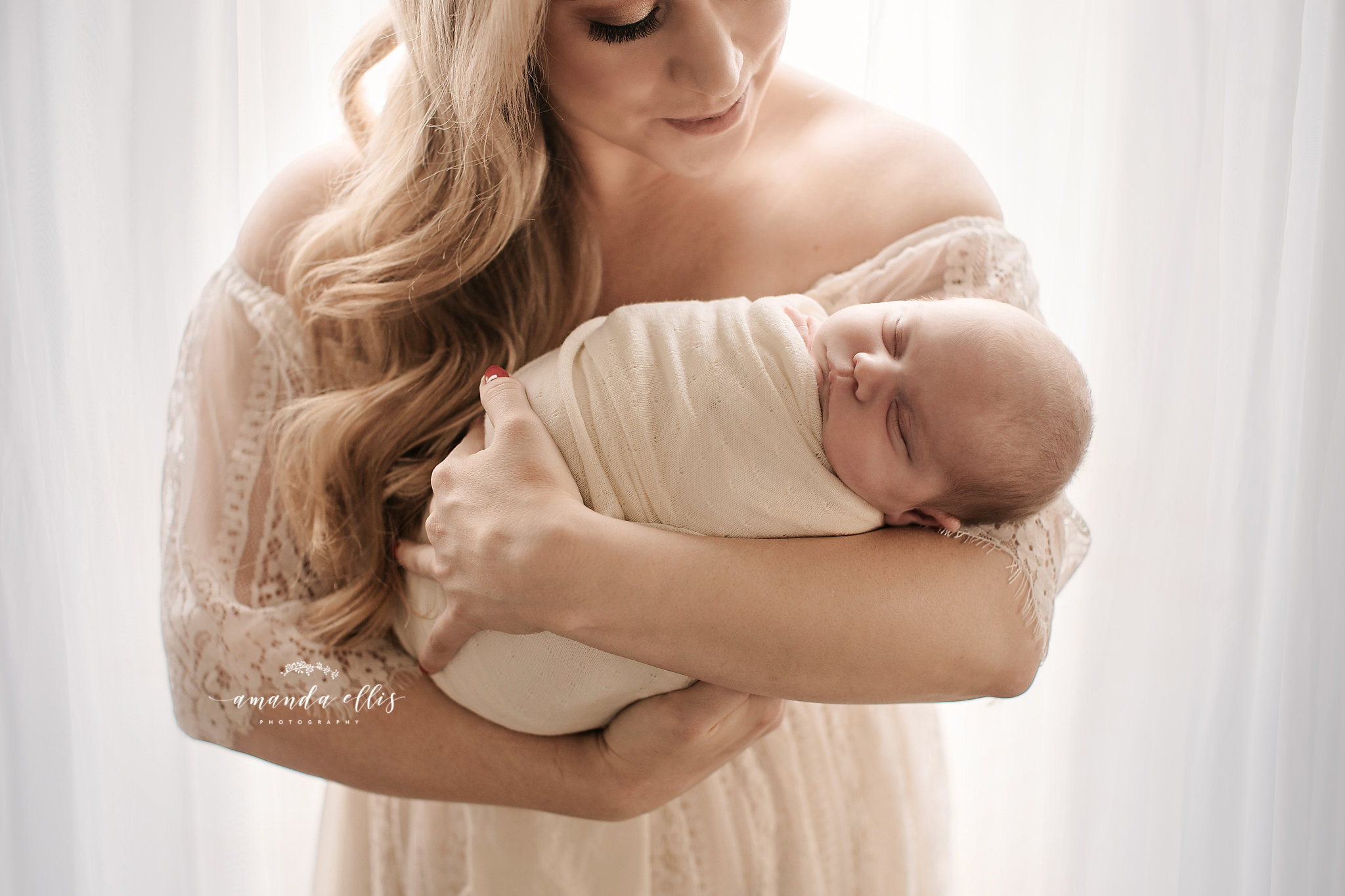 beautiful blonde mom with her infant daughter