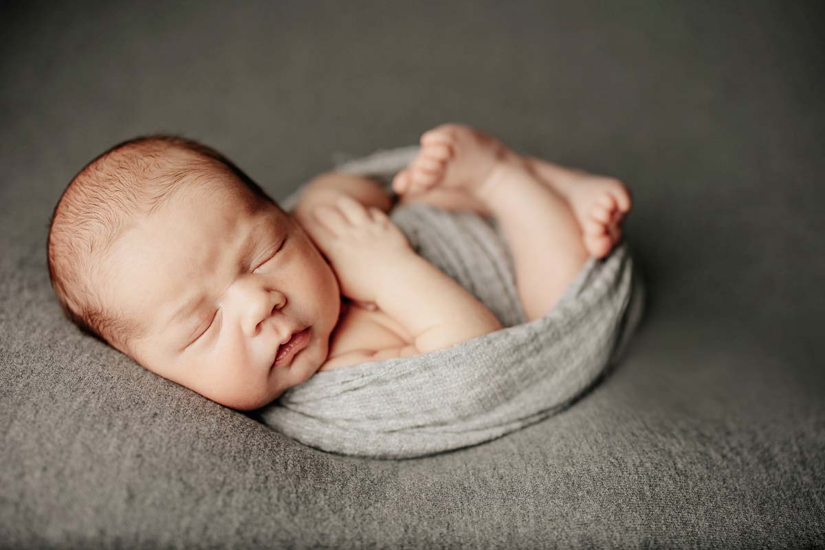 Capturing Precious Moments: Ensuring Safety in Newborn Photography with Akron Newborn Photographer.